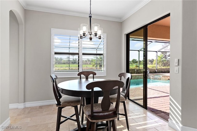 dining room with a chandelier and ornamental molding