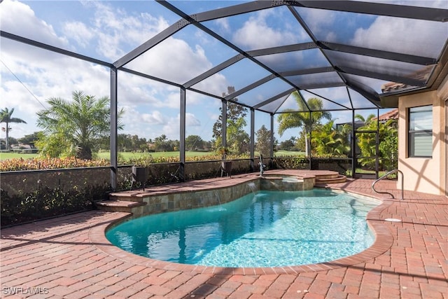 view of swimming pool featuring a lanai, an in ground hot tub, and a patio