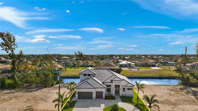 birds eye view of property with a water view