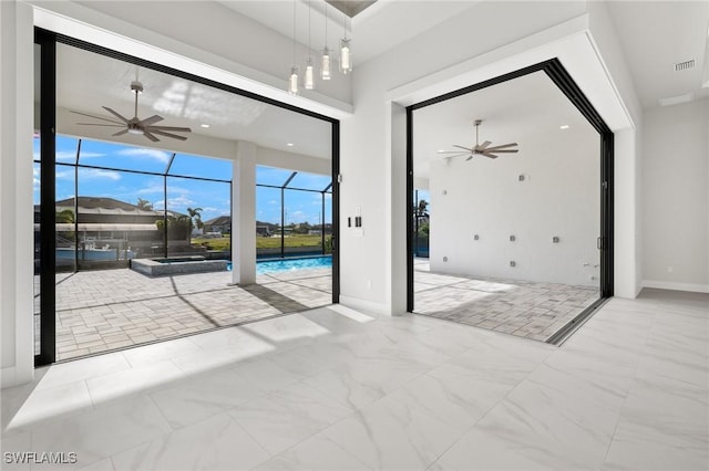 entryway featuring ceiling fan