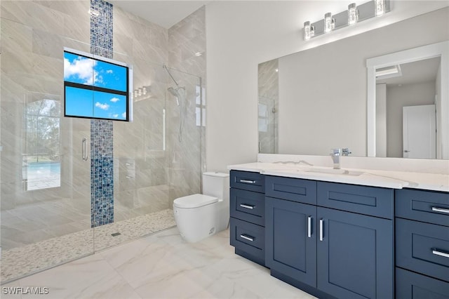 bathroom with plenty of natural light, vanity, an enclosed shower, and toilet