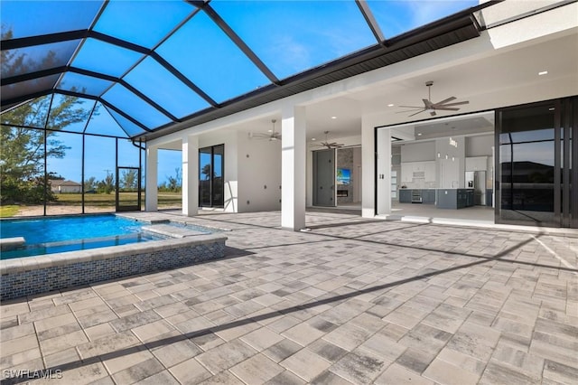 view of swimming pool with an in ground hot tub, a patio area, ceiling fan, and a lanai