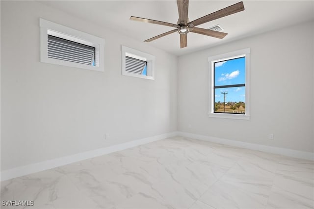 spare room with ceiling fan