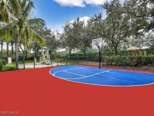 view of sport court with a playground