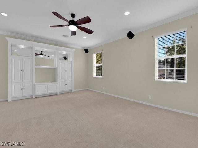 unfurnished bedroom with light carpet, ceiling fan, and crown molding