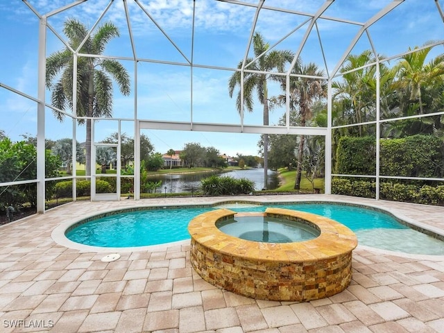 view of swimming pool with glass enclosure, a water view, and an in ground hot tub