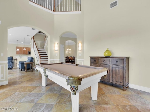 game room with a high ceiling and pool table