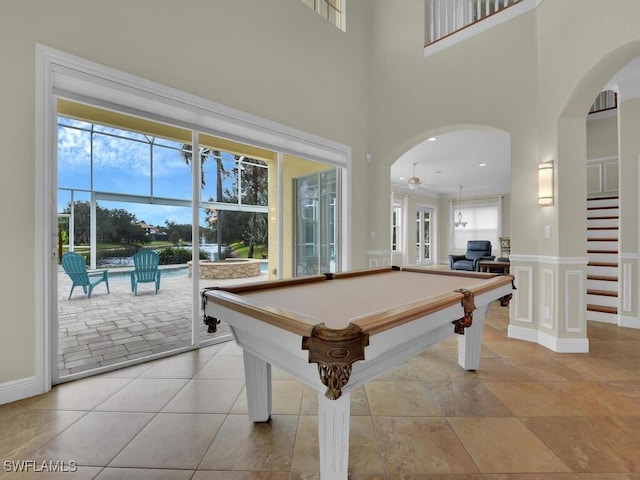 game room featuring ceiling fan, a high ceiling, and billiards