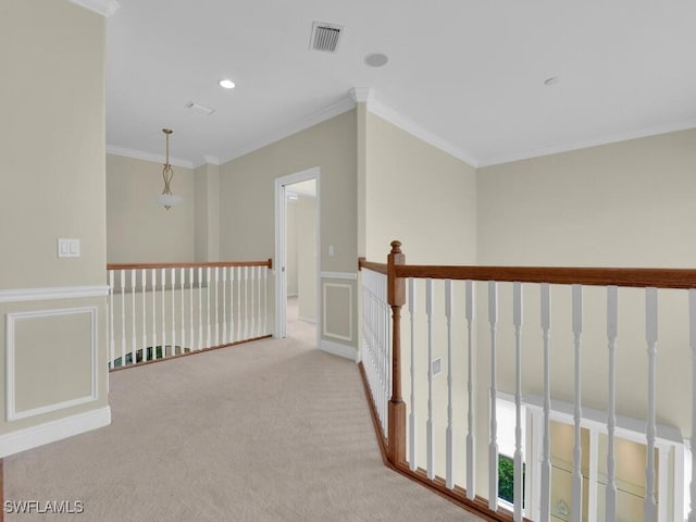 hall with light carpet and crown molding