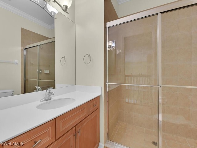 bathroom featuring vanity, toilet, walk in shower, and ornamental molding