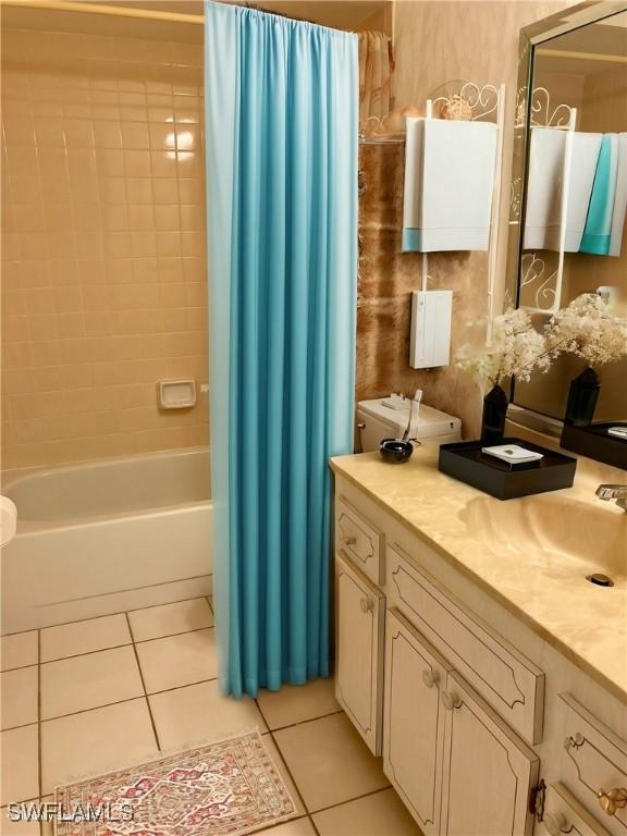 3923 SE 11th Ave Unit 304, Cape Coral, FL 33904 - full bathroom featuring tile patterned floors, shower / bathtub combination with curtain, and vanity
