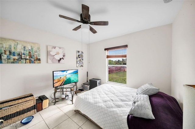 bedroom with ceiling fan and light tile patterned floors