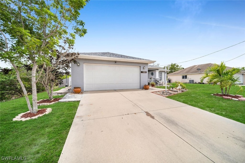 ranch-style house featuring a front yard and a garage