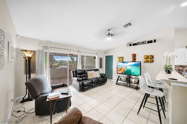 tiled living room with ceiling fan and lofted ceiling