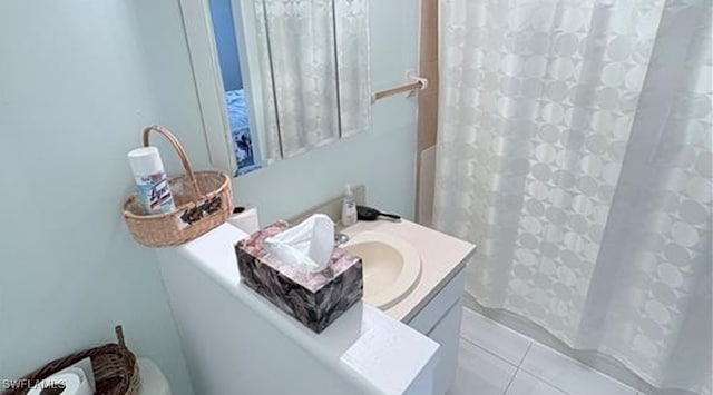 bathroom with tile patterned floors, vanity, and toilet