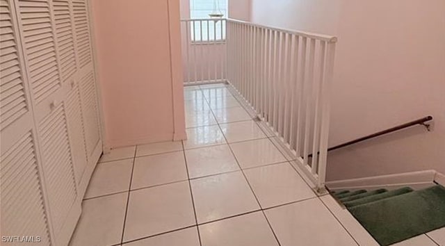 hall featuring light tile patterned flooring