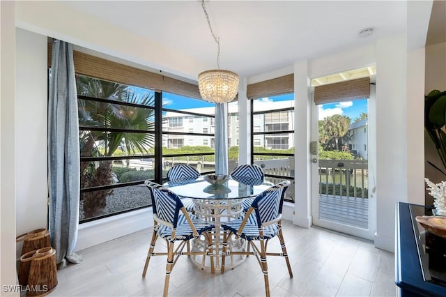 sunroom with a notable chandelier