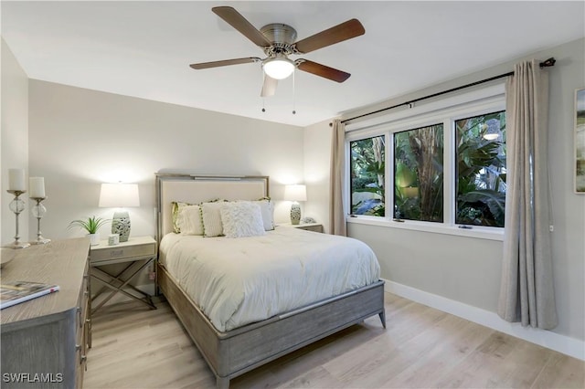 bedroom featuring light hardwood / wood-style floors and ceiling fan