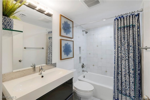 full bathroom featuring vanity, toilet, and shower / bathtub combination with curtain