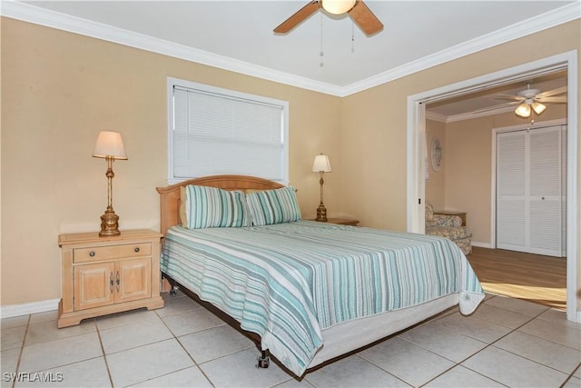 tiled bedroom with ceiling fan and ornamental molding