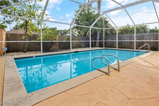 view of pool featuring a patio area and a lanai