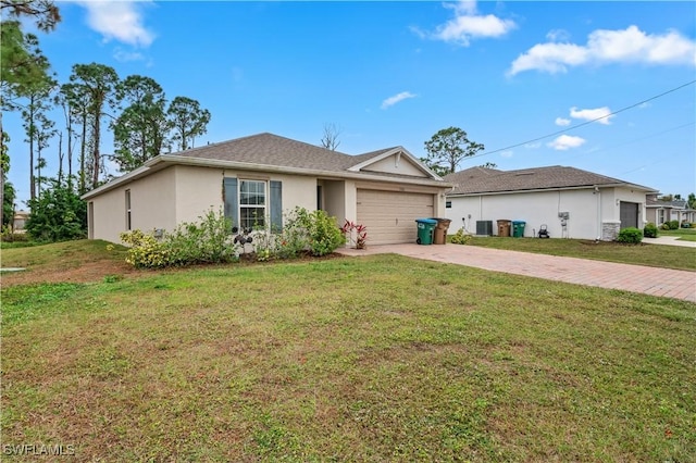 single story home featuring a garage, central AC, and a front lawn