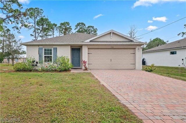 single story home featuring a garage and a front yard