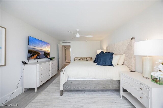 bedroom featuring light hardwood / wood-style flooring and ceiling fan