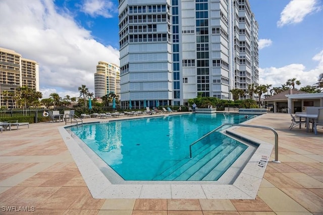 view of swimming pool featuring a patio