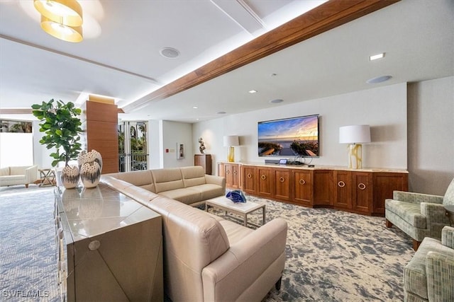 carpeted living room with beam ceiling