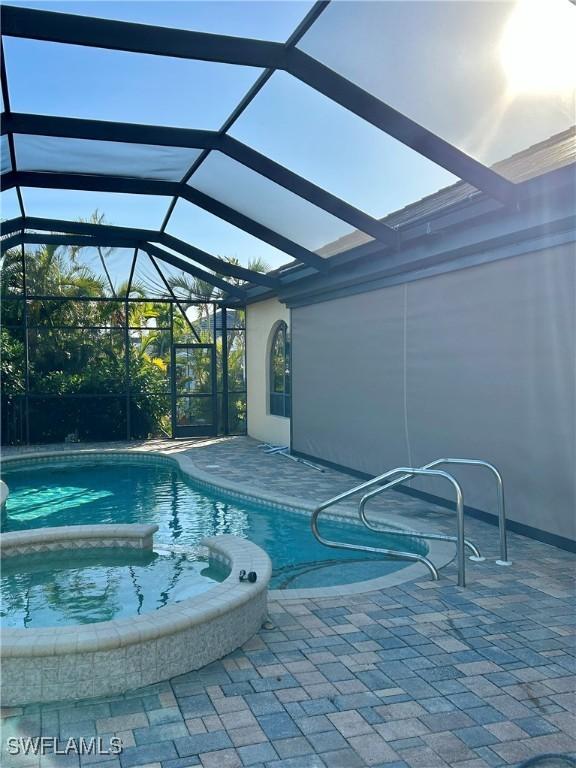 view of pool featuring a lanai and a patio