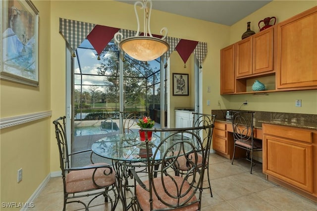 dining space with light tile patterned floors