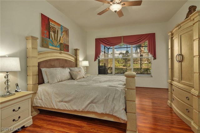 bedroom featuring ceiling fan and dark hardwood / wood-style floors