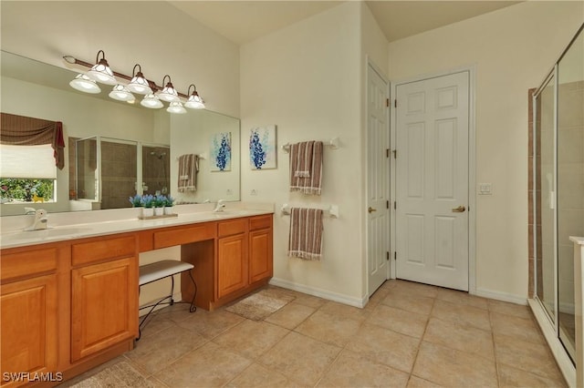 bathroom featuring tile patterned floors, vanity, and an enclosed shower