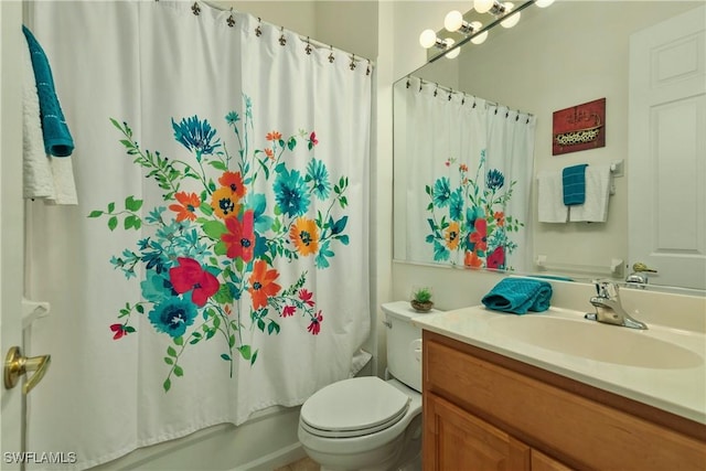 full bathroom with vanity, shower / tub combo, and toilet