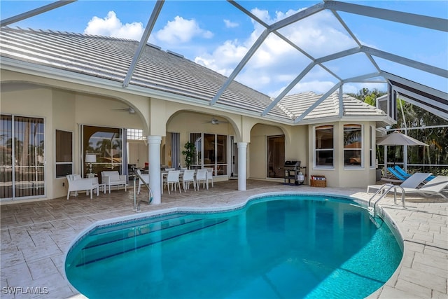 5210 Sands Blvd, Cape Coral, FL 33914 - back of property featuring a patio area, ceiling fan, an outdoor pool, stucco siding, and outdoor dining area