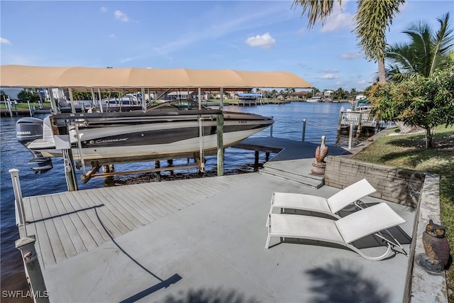 5210 Sands Blvd, Cape Coral, FL 33914 - dock featuring boat lift and a water view