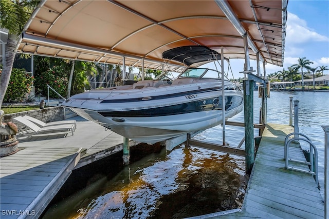 5210 Sands Blvd, Cape Coral, FL 33914 - dock area featuring boat lift and a water view