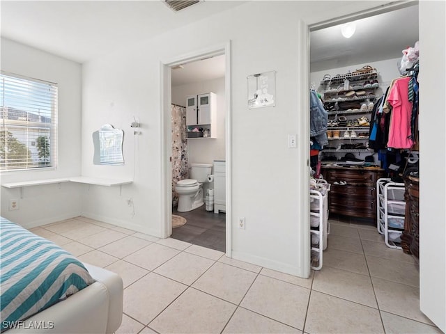 bathroom featuring tile patterned floors and toilet