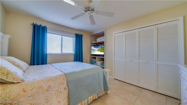 tiled bedroom with a closet and ceiling fan