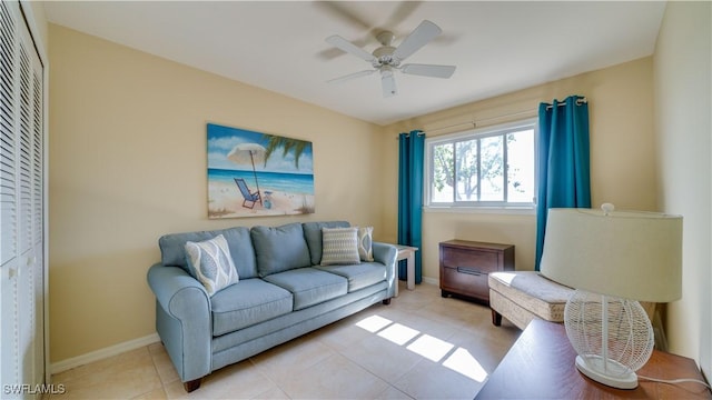 living room featuring ceiling fan and light tile patterned flooring