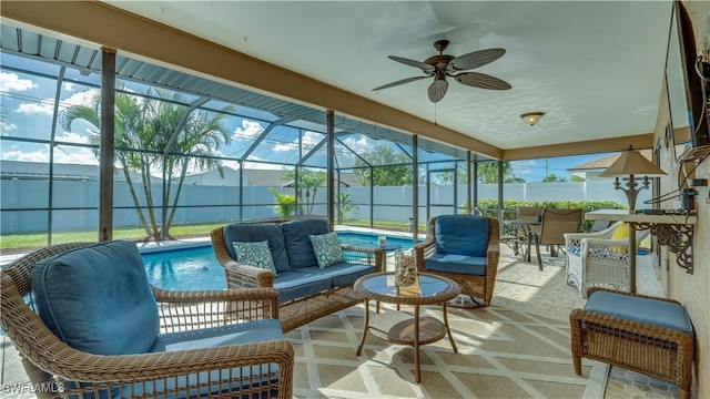 sunroom / solarium featuring ceiling fan and a pool