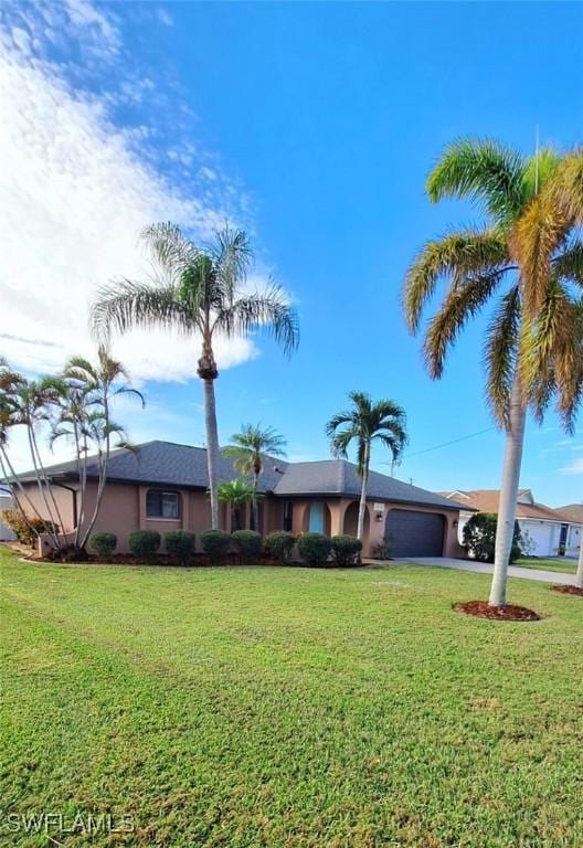 ranch-style house with a front lawn and a garage