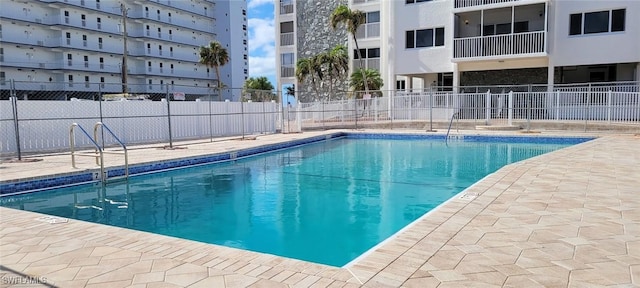 view of swimming pool with a patio