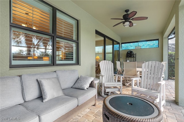 sunroom / solarium with ceiling fan