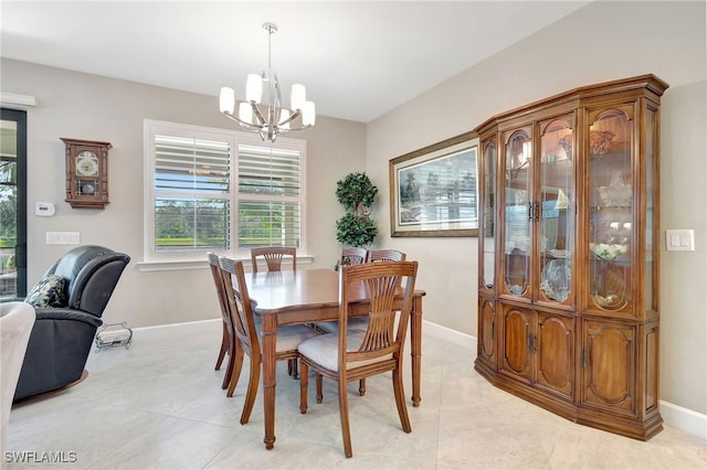 tiled dining room with a notable chandelier