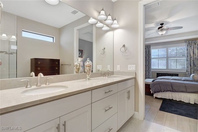 bathroom featuring ceiling fan, tile patterned flooring, and vanity