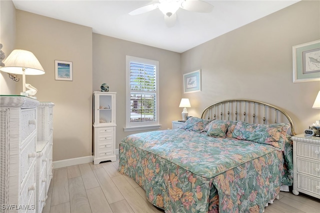 bedroom with ceiling fan and light hardwood / wood-style flooring