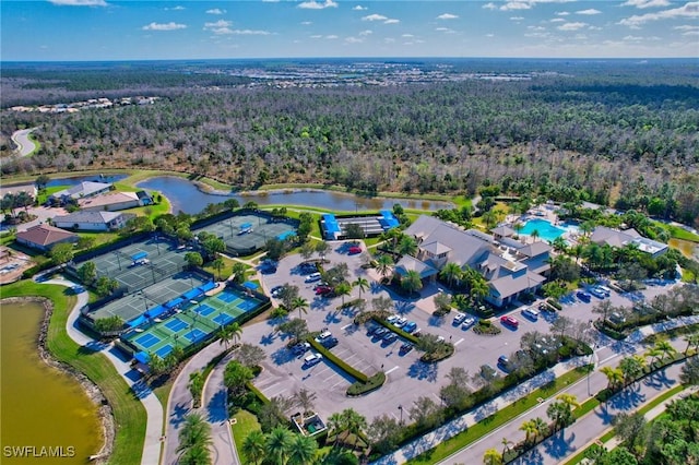 birds eye view of property with a water view