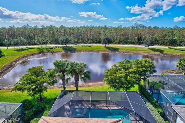 birds eye view of property with a water view